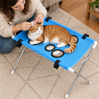 Blue stand - cat resting on the blue grooming stand during an ear clean