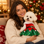 Woman cuddling her dog in the Santa dress by the Christmas tree