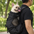 Black backpack - close-up of the mesh side panel and front buckle strap