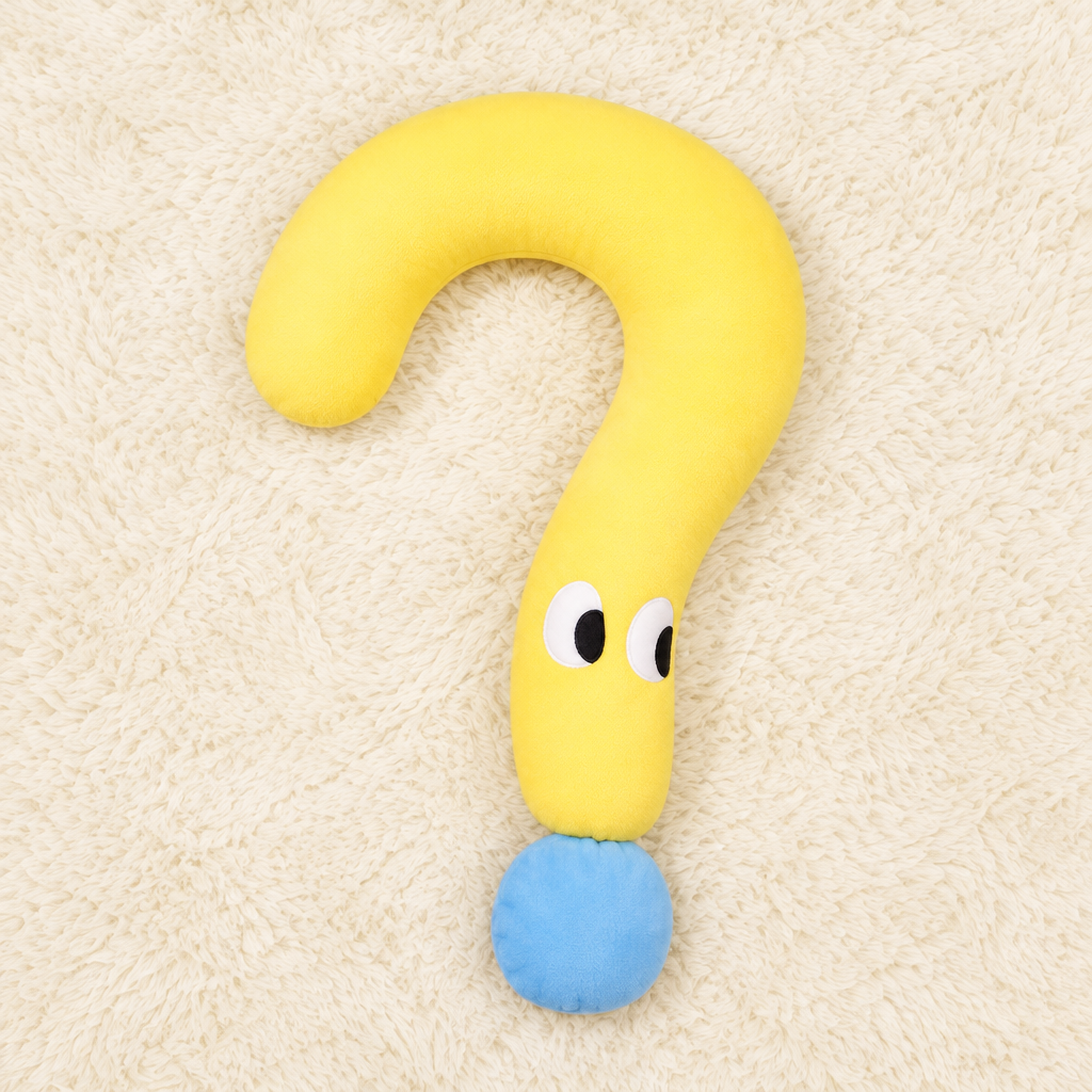 Yellow plush pet pillow on a cream rug